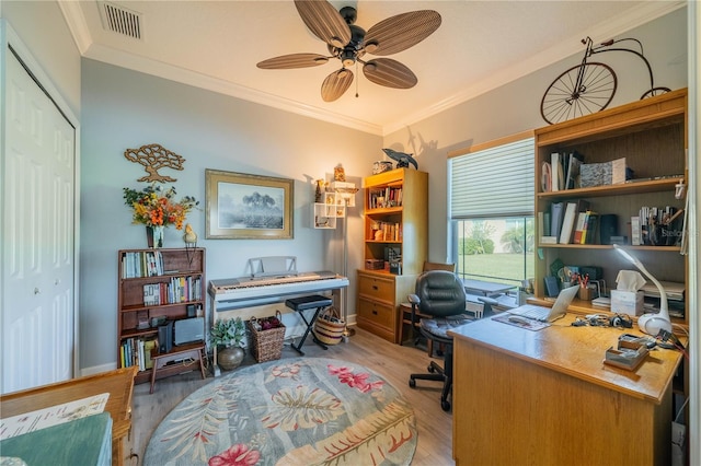 office area with light hardwood / wood-style flooring, ceiling fan, and ornamental molding