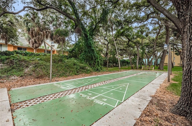 view of property's community featuring shuffleboard