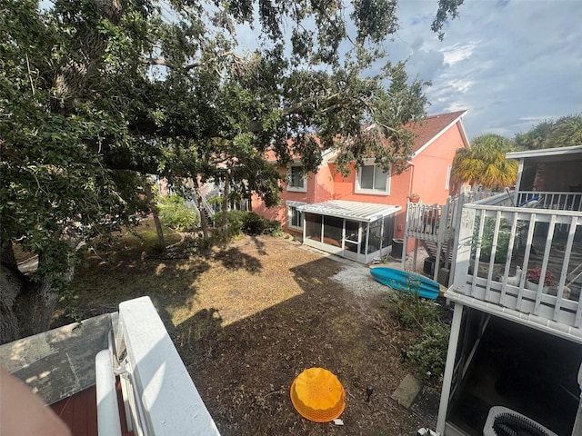 view of yard featuring a sunroom