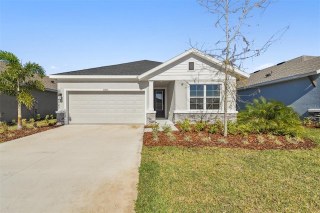 ranch-style home featuring driveway, stone siding, a garage, a front yard, and stucco siding