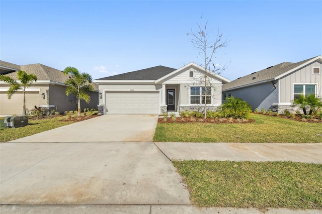 ranch-style house with a front yard and a garage