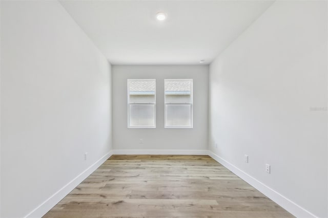 unfurnished room with light wood-type flooring