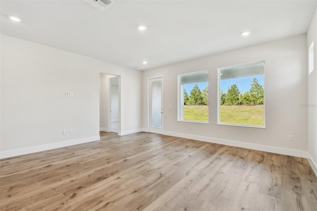 unfurnished room with light hardwood / wood-style floors