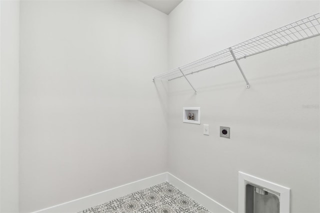 washroom featuring electric dryer hookup, hookup for a washing machine, laundry area, and baseboards