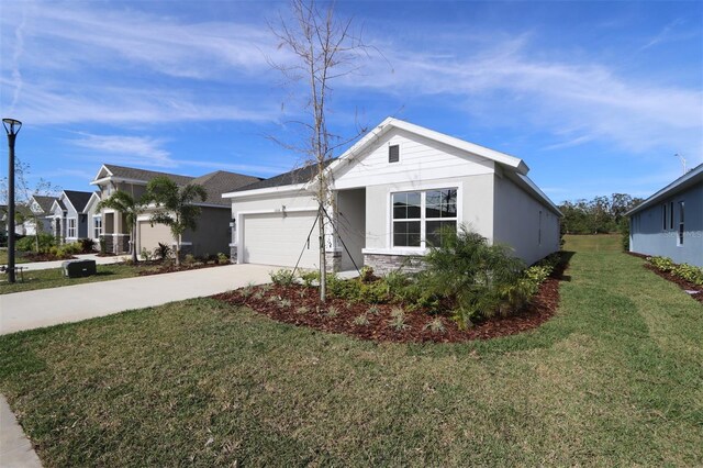 11814 Richmond Trl, Parrish, FL 34219 - ranch-style home featuring concrete driveway, a garage, a front lawn, stucco siding, and central air condition unit