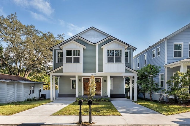 view of front of home featuring cooling unit and covered porch