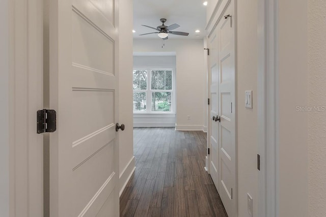 corridor featuring dark hardwood / wood-style floors