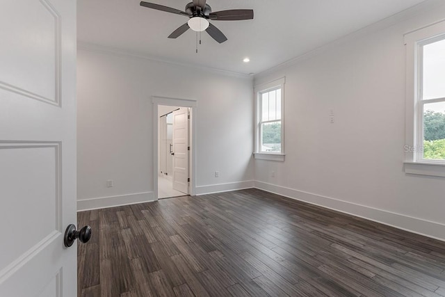 unfurnished room featuring ceiling fan, dark hardwood / wood-style floors, and crown molding