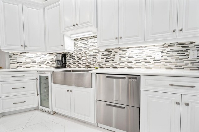 kitchen with sink, tasteful backsplash, wine cooler, stainless steel dishwasher, and white cabinets