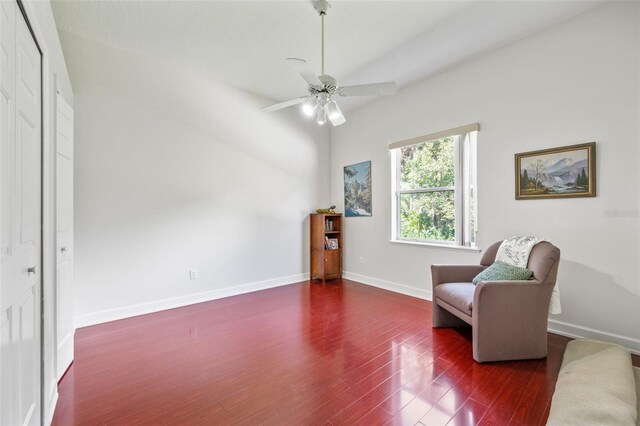 sitting room with ceiling fan and dark hardwood / wood-style floors