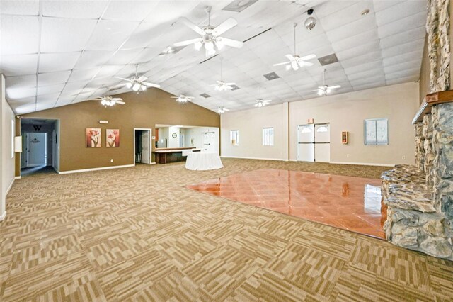 interior space featuring lofted ceiling and a fireplace