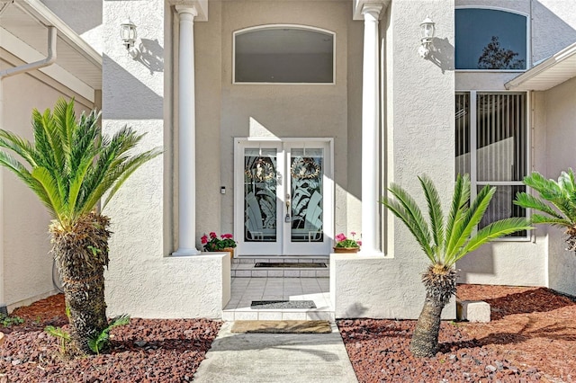 property entrance featuring french doors