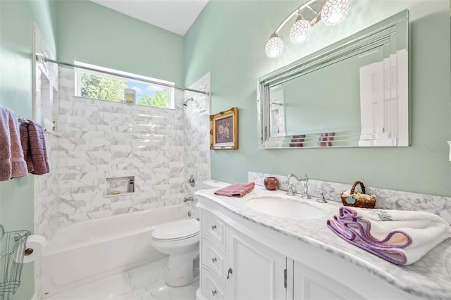 full bathroom featuring vanity, toilet, and tiled shower / bath combo