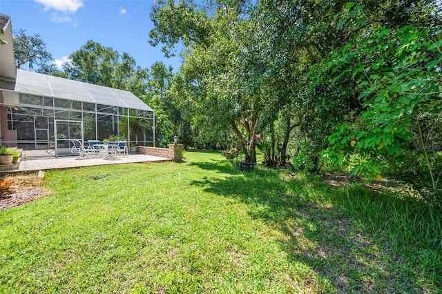 view of yard with a patio area and a lanai