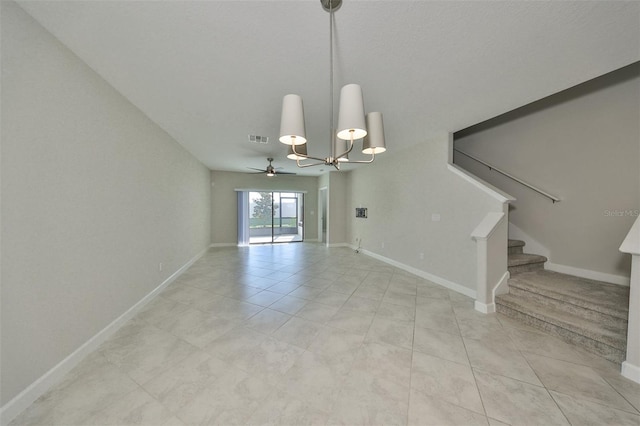 interior space with ceiling fan with notable chandelier