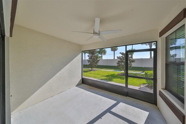 16850 Whisper Elm St, Wimauma, FL 33598 - unfurnished sunroom featuring ceiling fan