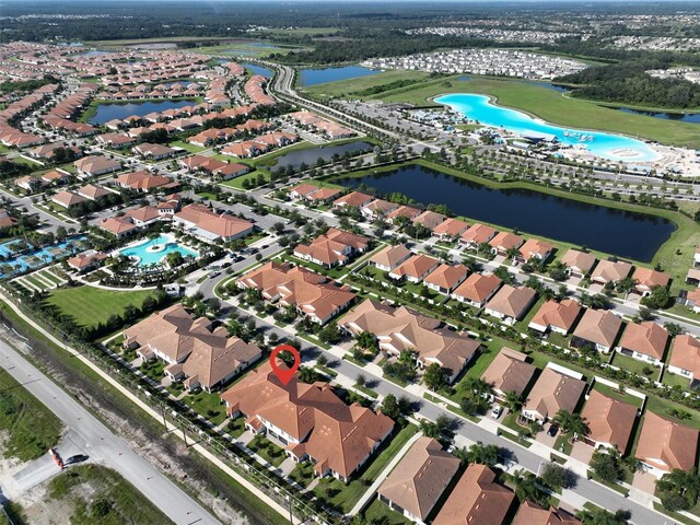 16850 Whisper Elm St, Wimauma, FL 33598 - aerial view of property and surrounding area with a pool, a nearby body of water, and nearby suburban area