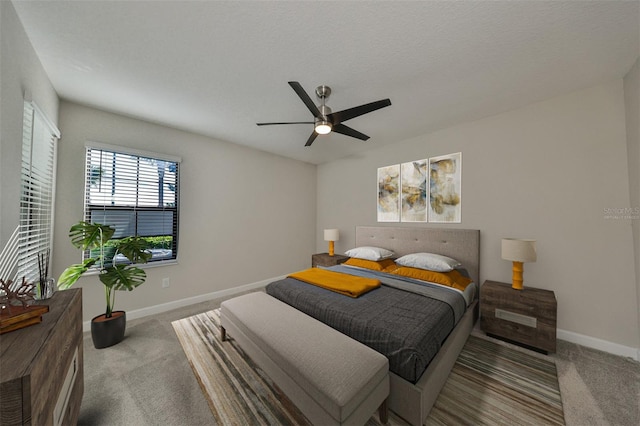 bedroom featuring light colored carpet and ceiling fan