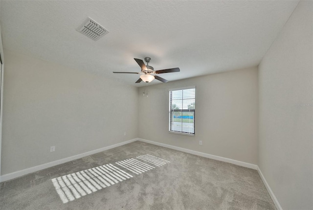 16850 Whisper Elm St, Wimauma, FL 33598 - carpeted empty room with a ceiling fan and baseboards