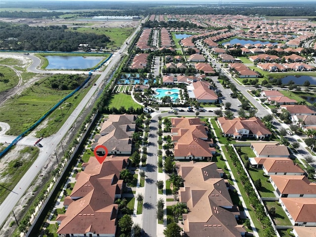 16850 Whisper Elm St, Wimauma, FL 33598 - aerial view of property and surrounding area with nearby suburban area and a nearby body of water