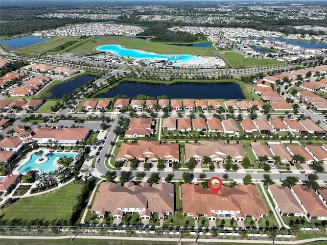 16850 Whisper Elm St, Wimauma, FL 33598 - aerial overview of property's location with nearby suburban area, a pool area, and a large body of water