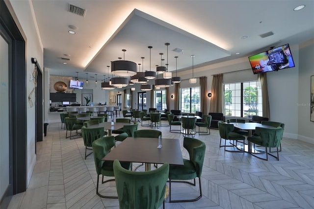 dining space featuring light parquet flooring