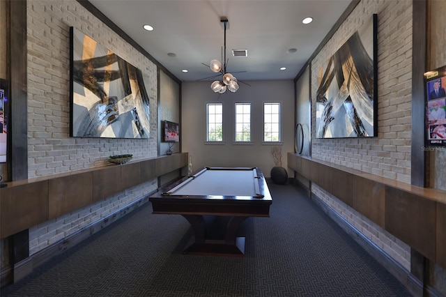 recreation room with brick wall, billiards, ornamental molding, and carpet flooring