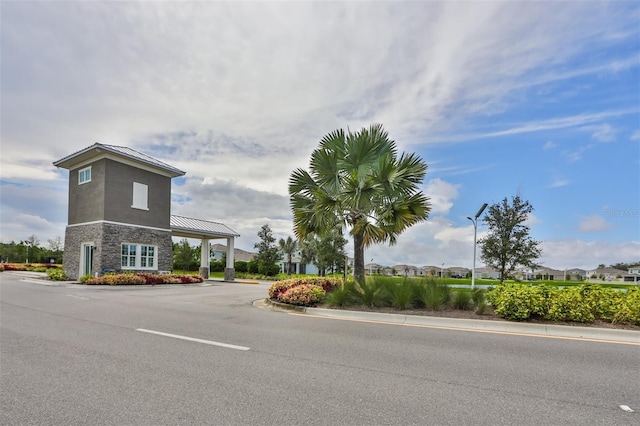 16850 Whisper Elm St, Wimauma, FL 33598 - view of asphalt street featuring street lighting and curbs