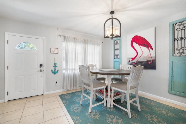 dining area with a chandelier, light tile patterned flooring, and a healthy amount of sunlight