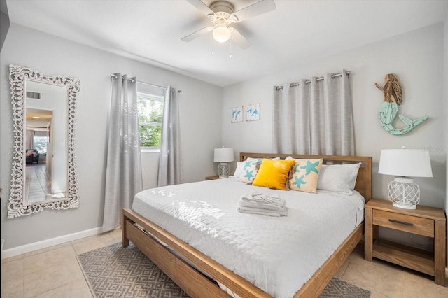 tiled bedroom with ceiling fan