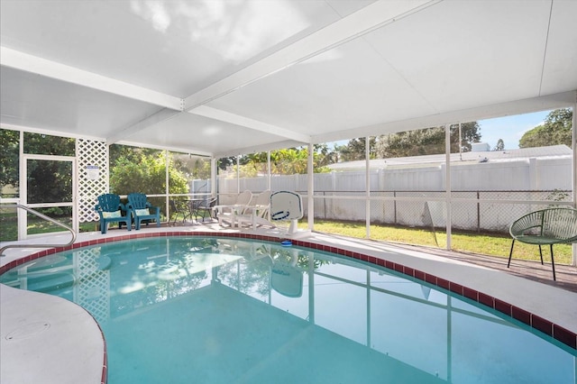 view of swimming pool with a patio and a yard