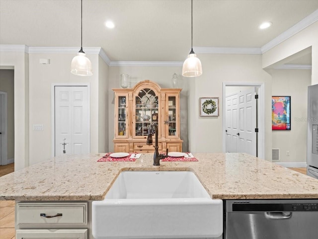 kitchen with an island with sink, crown molding, decorative light fixtures, stainless steel dishwasher, and sink