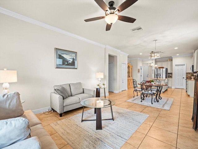 tiled living room featuring ceiling fan with notable chandelier and crown molding