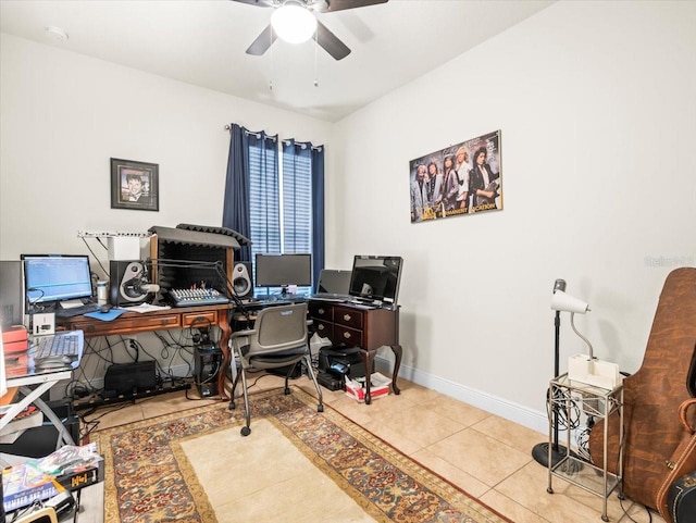 tiled office space featuring ceiling fan