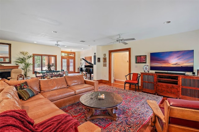 living room with hardwood / wood-style floors and ceiling fan