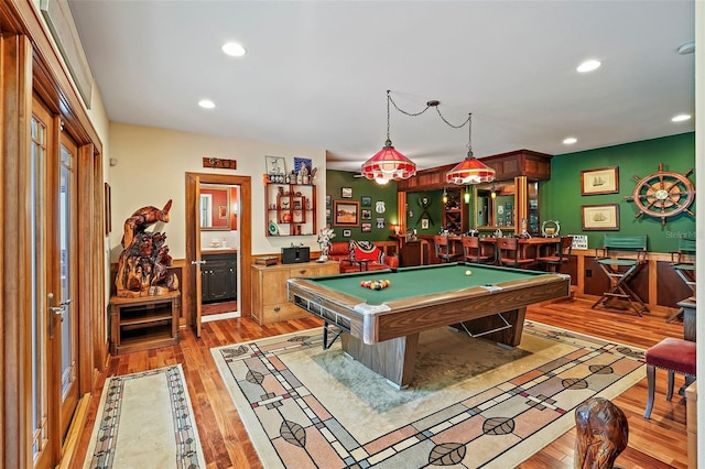 game room featuring bar, hardwood / wood-style floors, and billiards