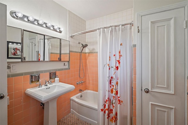 bathroom with tile walls, shower / bath combo, and tile patterned floors