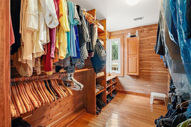 spacious closet with light hardwood / wood-style floors