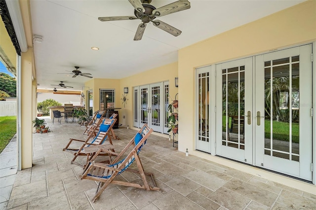 view of patio featuring french doors and ceiling fan