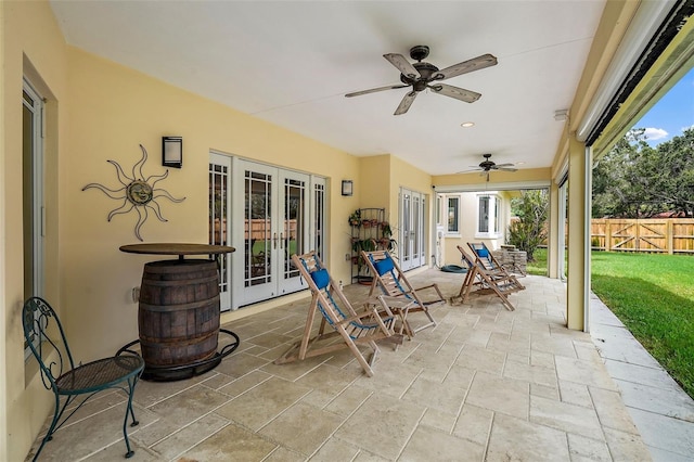 view of patio with ceiling fan and french doors