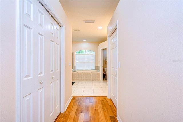 hallway featuring light hardwood / wood-style floors