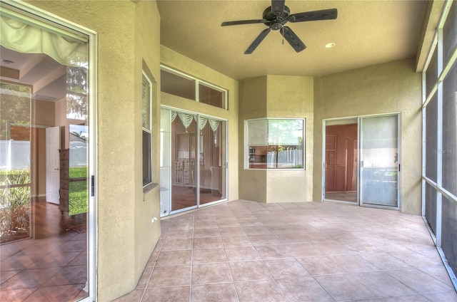 view of patio featuring ceiling fan