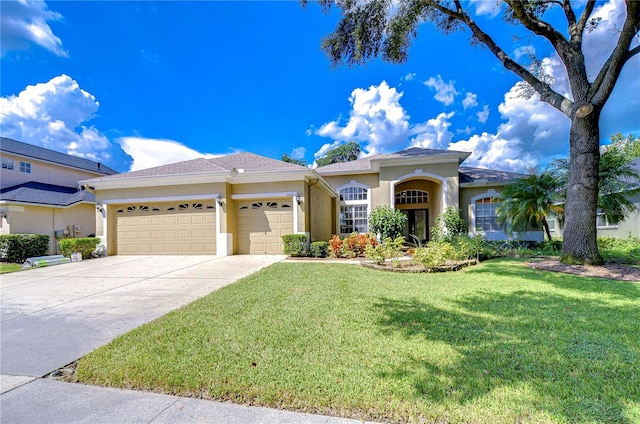 view of front facade featuring a front yard and a garage