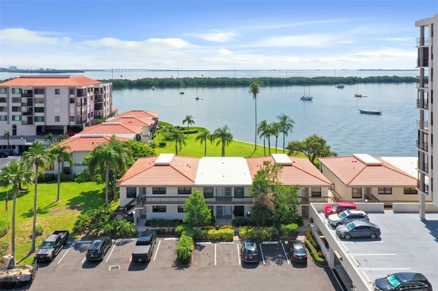 birds eye view of property with a water view