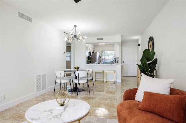 dining space with a notable chandelier