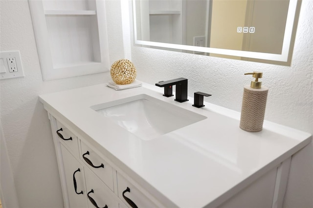 6291 Bahia Del Mar Cir Unit 103, Saint Petersburg, FL 33715 - interior details with a textured wall and vanity