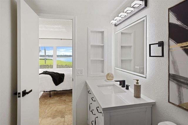 bathroom with vanity, built in features, and tile patterned flooring