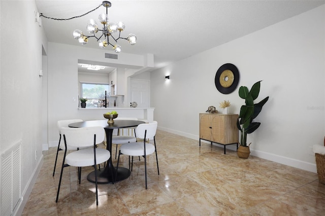 dining area with a notable chandelier