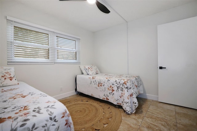 tiled bedroom with ceiling fan