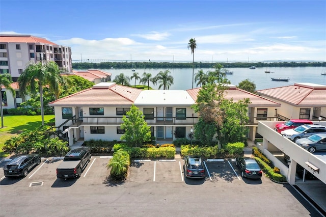 birds eye view of property with a water view